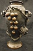 A Japanese Meiji period bronze vase, chocolate patinated with high relief grape and vine decoration,