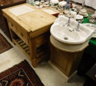 A pine butchers block/kitchen island with marble section to top above two drawers and pot shelf