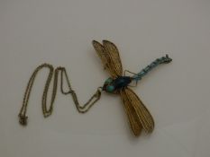 An early 20th Century gilt metal and enamel decorated dragonfly brooch / pendant in the Tiffany