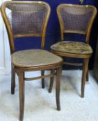 A set of five caned dining chairs,