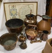 A collection of copper ware to include a beaten copper water vessel,