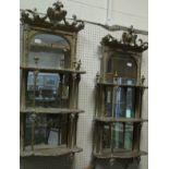 A pair of 19th Century wall mirrors with three serpentine fronted shelves CONDITION