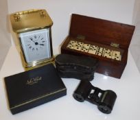 A mahogany cased set of bone and ebony dominoes, a boxed "Solo Whist" game with cards and counters,