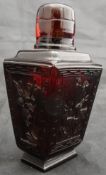 A 19th Century Chinese ruby amber scent bottle of tapering faceted rectangular form,