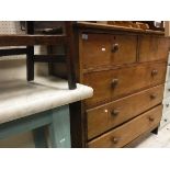 An oak chest of two short over three long drawers and a marble topped side table on a painted base