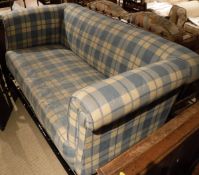 A circa 1900 upholstered two seat sofa in blue and white check,