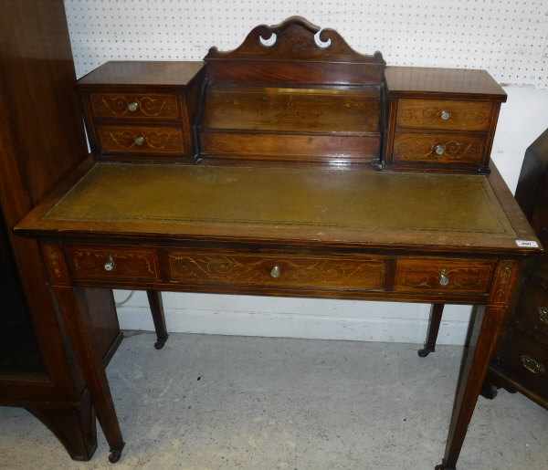 A circa 1900 rosewood and marquetry inlaid ladies writing table by James Shoolbred & Co.