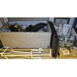 A rush work decorated trunk and contents of various lamps, handbag, mirrors,