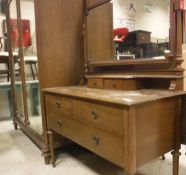 An early 20th Century oak wardrobe compactum with matching dressing chest and pot cupboard