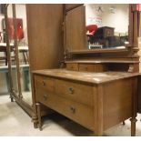 An early 20th Century oak wardrobe compactum with matching dressing chest and pot cupboard