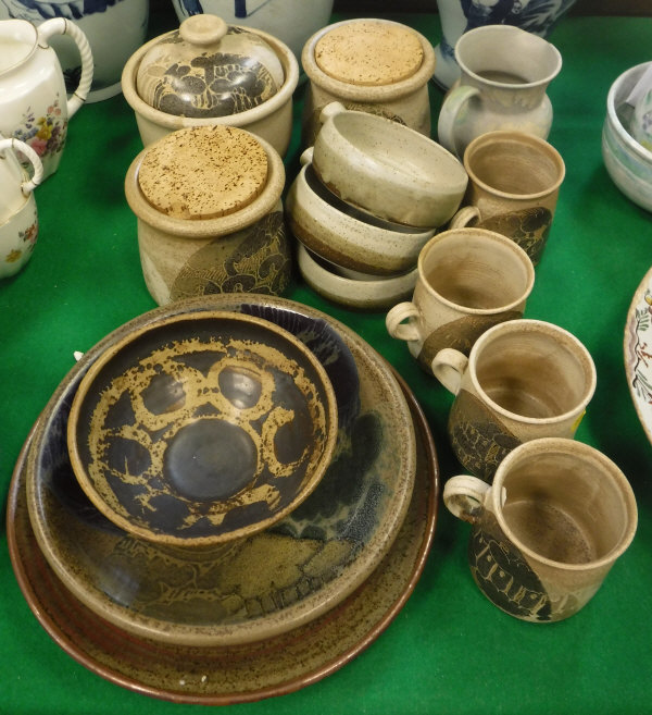 A collection of Diana Worthy Studio Pottery mugs, jars, plates and bowls, etc,