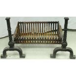 A modern wrought iron fire basket and a pair of fire dogs in the Gothic Revival style,