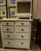 A modern painted pine chest of four short over two long drawers, matching bedside table,