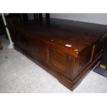 A modern Indian hardwood coffee table with side drawers,