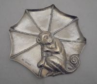 A Victorian silver pin dish in the form of a monkey holding an umbrella (by Thomas Johnson,