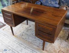 A mid 20th Century Danish rosewood desk by J Svenstrup for A P Mobler (Cert No.