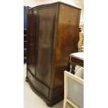A modern mahogany serpentine fronted wardrobe in the Louis Philippe taste,