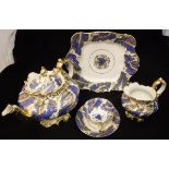 A 19th Century Rockingham style tea set, blue and gilt decorated, comprising teapot, cream jug,