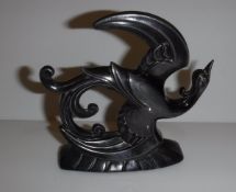 A metal car mascot in the form of a Phoenix (poss.