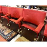 A set of three gold painted cast iron framed folding theatre seats with upholstered back,