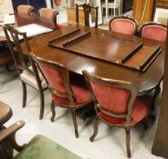 A reproduction mahogany rounded rectangular twin pedestal dining table,