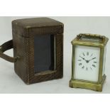 A circa 1900 French lacquered brass cased carriage clock, the dial with Roman numerals,