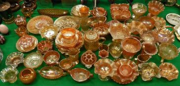 A large quantity of various carnival glass ware, including bowls, dishes, vases,