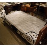 A 19th Century French wrought iron folding bedstead with modern mattress CONDITION