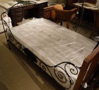 A 19th Century French wrought iron folding bedstead with modern mattress CONDITION