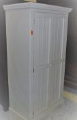 A modern painted pine two door wardrobe with panelled doors CONDITION REPORTS Max