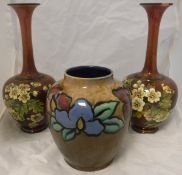 A Royal Doulton vase decorated with a band of flowers bearing indistinct monogram to base, No'd.