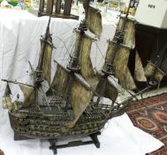 A painted wooden scale model of "The Victory", the sails of painted sail cloth,