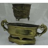 A 19th Century Chinese bronze censer with three toed dragon decoration in relief,