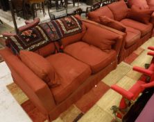 A pair of two seat sofas by Sofa Workshop in red upholstery