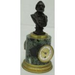 A 19th Century French marble and gilt metal cased mantle clock with bronze figural bust surmount,