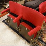 A set of two gold painted cast iron framed folding theatre seats with upholstered back,