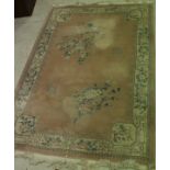 A Chinese superwash carpet with central floral medallion on a cream ground within a cream and pink