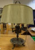 An early 20th Century bronzed and gilded metal three branch table lamp in the Egypto-Classical