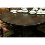 A Piers Pisani oak oval dining table in the 17th Century style,