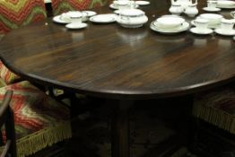 A Piers Pisani oak oval dining table in the 17th Century style,