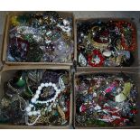 Four boxes containing various costume jewellery, bracelets, necklaces,