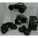 A pair of Mark Scheffel 10 x -30 x 50 binoculars, a pair of Regent 8 x 30 binoculars,