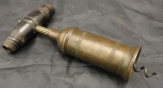 A 19th Century brass corkscrew, the cylinder with ringed decoration and domed shoulders,