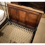 A pair of early 20th Century single oak bedsteads in the Heal's manner