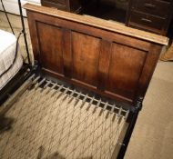 A pair of early 20th Century single oak bedsteads in the Heal's manner