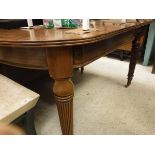 A late Victorian walnut D-end dining table of small proportions,