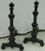 A pair of cast iron fire dogs in the French taste