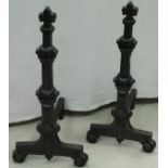 A pair of cast iron fire dogs in the French taste