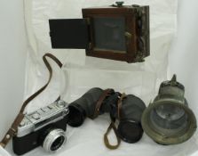 A mahogany cased Bellows Plate camera (incomplete), a Vest Pocket Autographic Kodak camera,