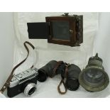 A mahogany cased Bellows Plate camera (incomplete), a Vest Pocket Autographic Kodak camera,